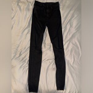 Black American Eagle jeans.